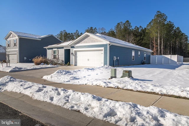 single story home with a garage