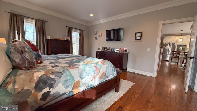 bedroom featuring stainless steel fridge, crown molding, dark hardwood / wood-style flooring, and multiple windows