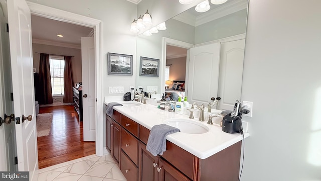 bathroom featuring vanity and ornamental molding