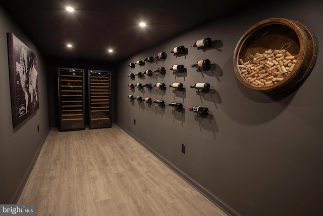 wine room with light hardwood / wood-style floors