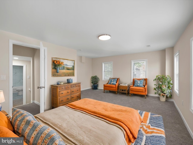 bedroom featuring carpet flooring and ensuite bath