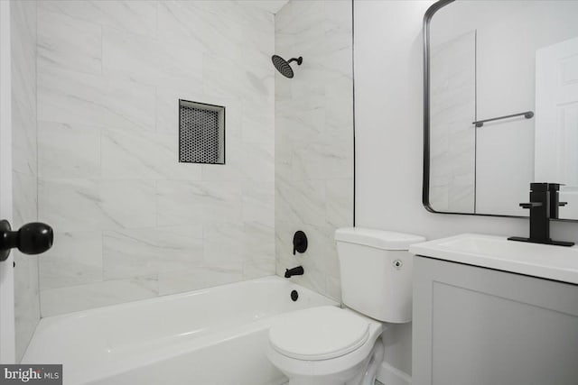 full bathroom with vanity, toilet, and tiled shower / bath