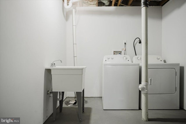 laundry room featuring sink and washing machine and clothes dryer