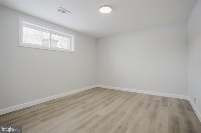 empty room with light wood-type flooring