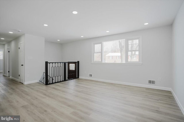 spare room with light wood-type flooring