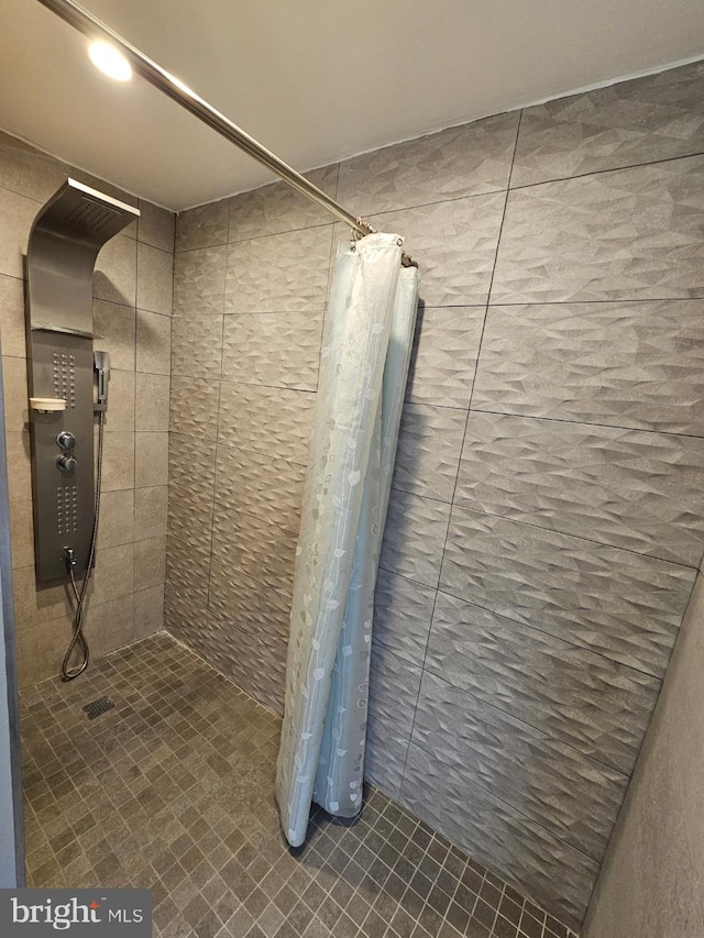 bathroom with a shower with curtain