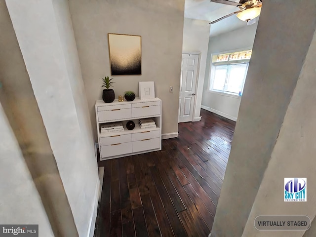 corridor with dark hardwood / wood-style floors