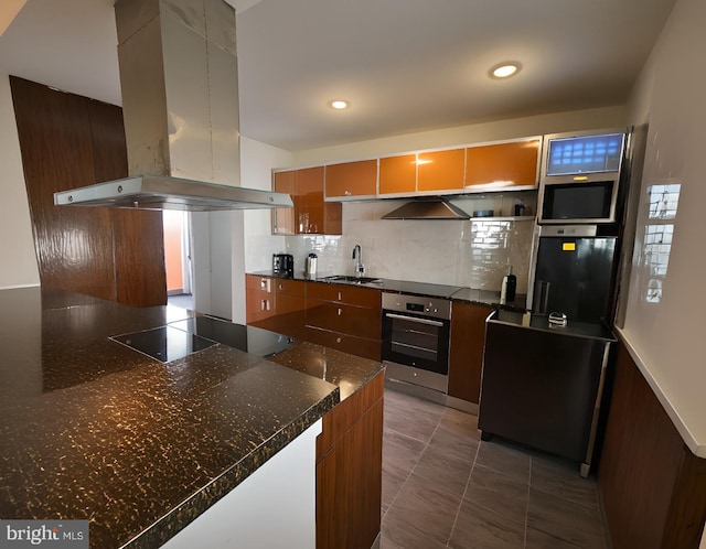 kitchen with extractor fan, black electric stovetop, sink, island exhaust hood, and stainless steel oven