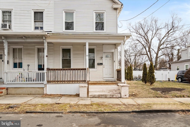 view of front facade featuring cooling unit and a porch