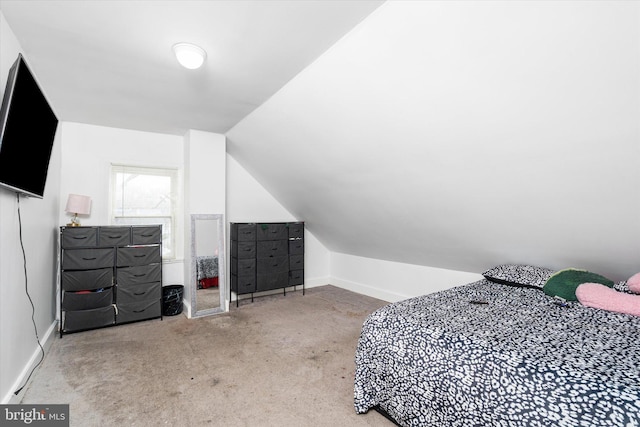 carpeted bedroom featuring vaulted ceiling