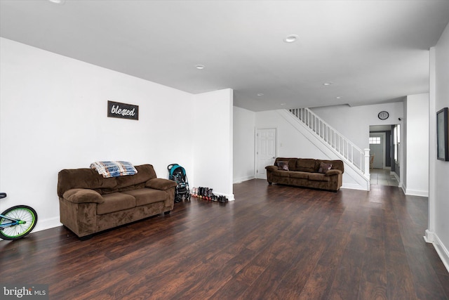 living room featuring dark wood-type flooring