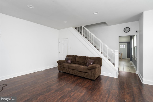 living room with dark hardwood / wood-style floors