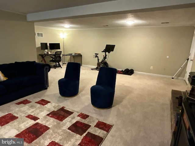 carpeted living room featuring beam ceiling