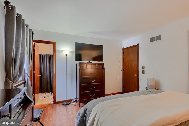 bedroom featuring light wood-type flooring