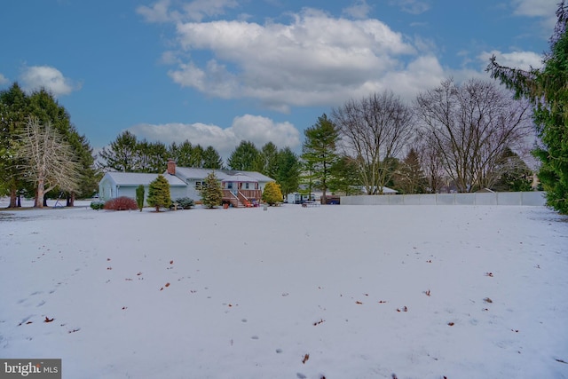 view of yard layered in snow