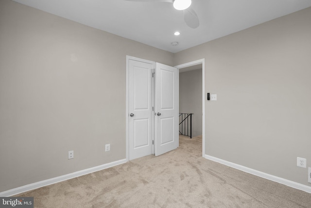 unfurnished bedroom featuring light colored carpet