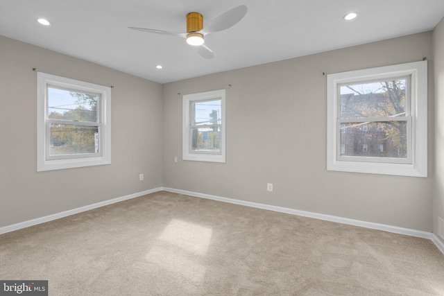 carpeted empty room with ceiling fan