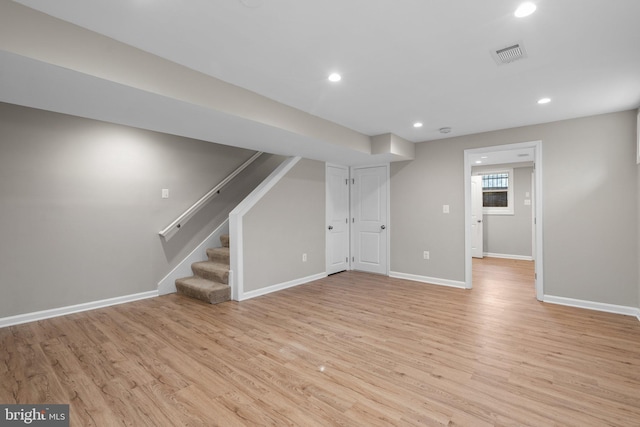 basement featuring light wood-type flooring