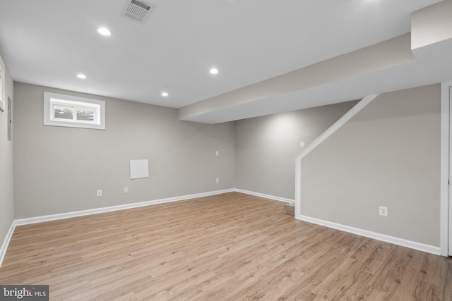 basement featuring light wood-type flooring