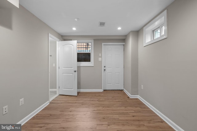 interior space featuring light hardwood / wood-style flooring and a healthy amount of sunlight