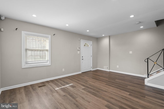 entryway with dark wood-type flooring