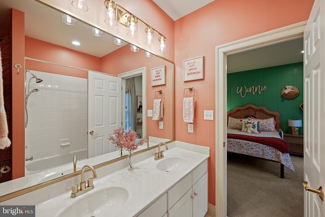 bathroom with vanity and tiled shower / bath