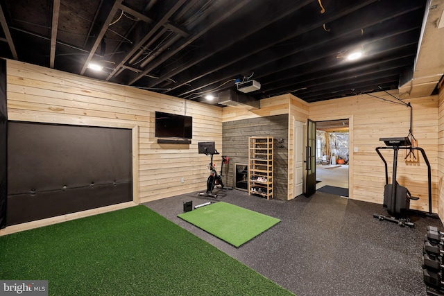 exercise room with wooden walls