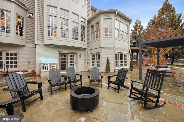 view of patio / terrace with an outdoor fire pit