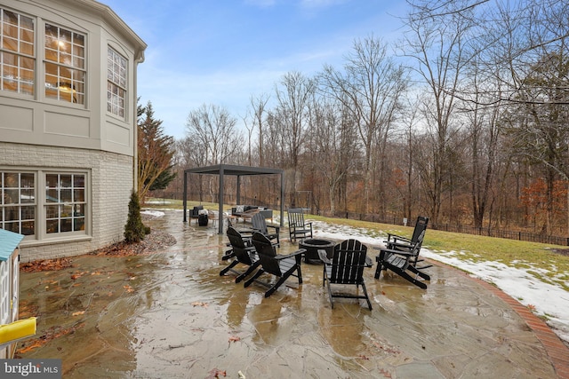 view of patio with a gazebo and a fire pit