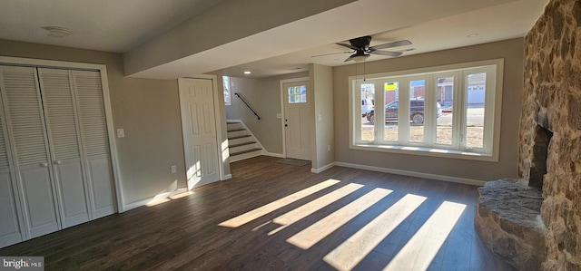 unfurnished living room with ceiling fan and dark hardwood / wood-style floors