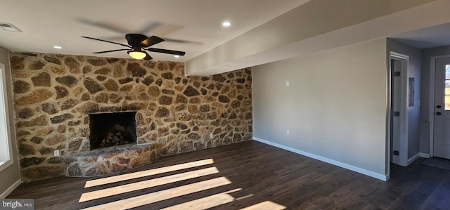 unfurnished living room featuring dark hardwood / wood-style flooring, a fireplace, and ceiling fan