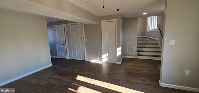 interior space with dark hardwood / wood-style flooring