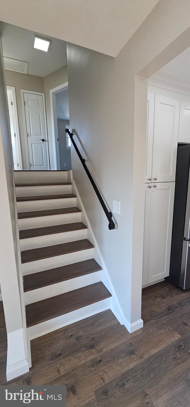 stairway featuring hardwood / wood-style floors