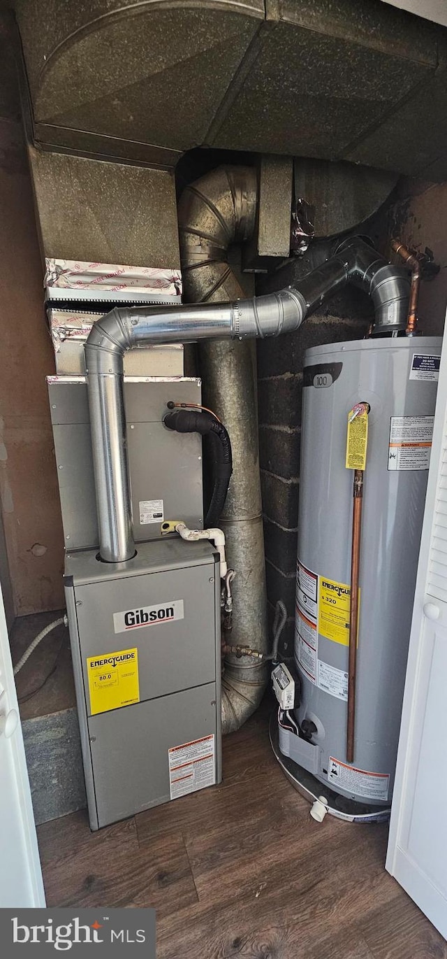 utilities featuring water heater and heating unit