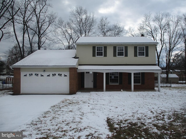 front facade featuring covered porch and a garage