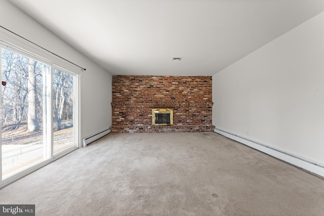 unfurnished living room featuring brick wall, a brick fireplace, carpet floors, and baseboard heating