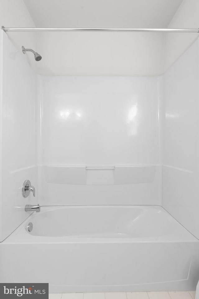 bathroom featuring tile patterned floors and shower / bath combination