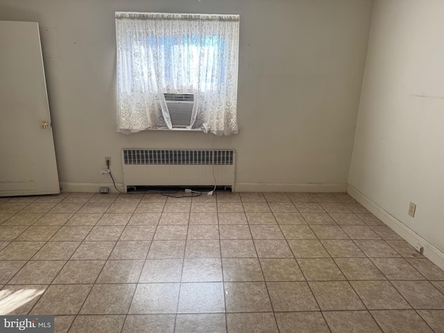 tiled empty room with radiator heating unit