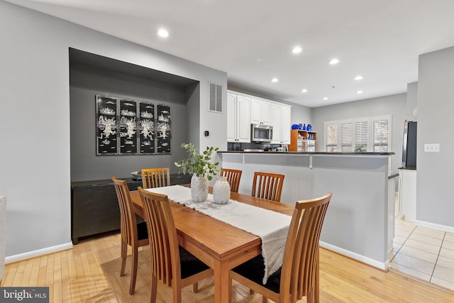 dining area with light hardwood / wood-style flooring