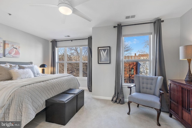 bedroom featuring ceiling fan and light colored carpet