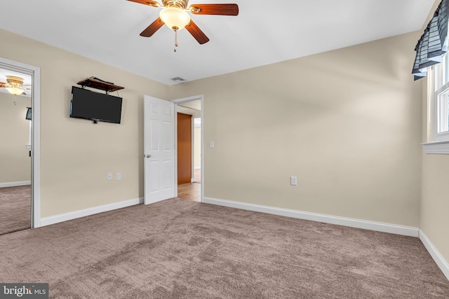 unfurnished bedroom with ceiling fan and carpet floors