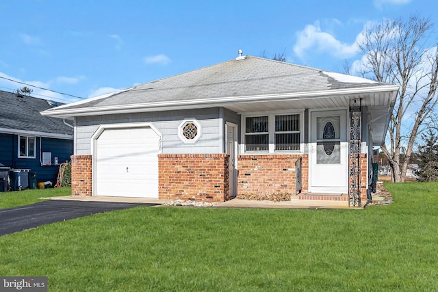 ranch-style home with a front lawn and a garage