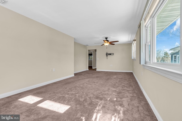 empty room featuring carpet and ceiling fan