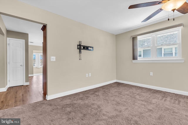 unfurnished room with ceiling fan and carpet floors