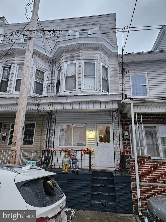 view of property with a porch