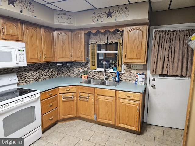 kitchen with tasteful backsplash, white appliances, sink, and light tile patterned floors