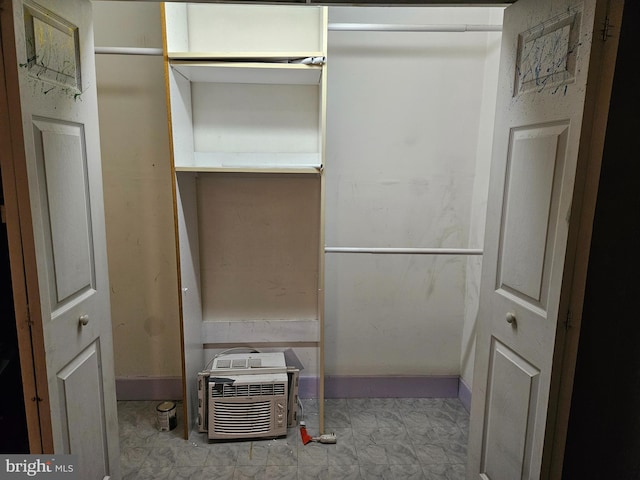 closet featuring a wall mounted air conditioner