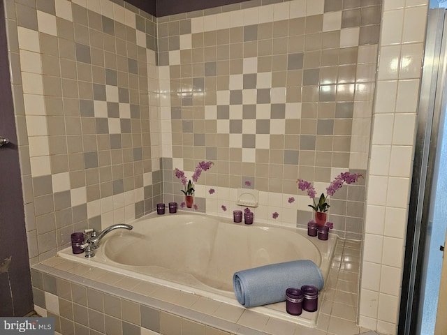 bathroom with a relaxing tiled tub