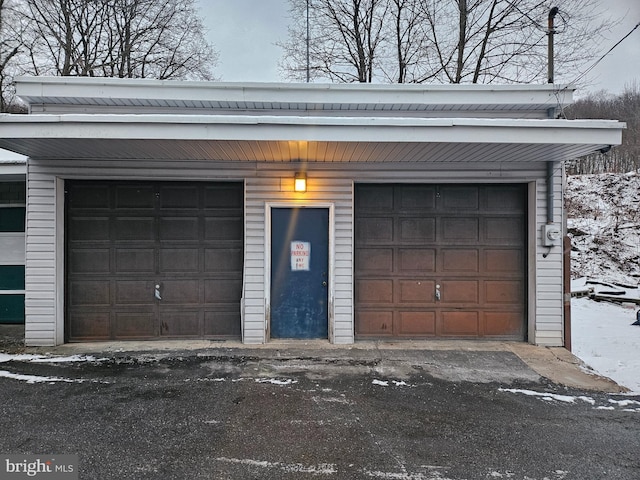 view of snow covered garage