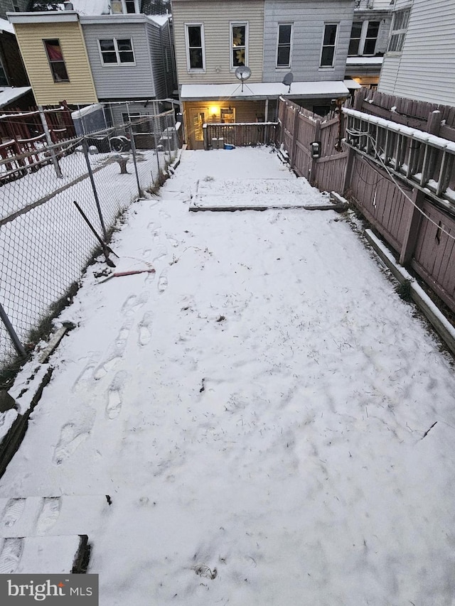 view of yard covered in snow